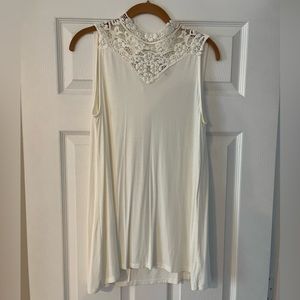 White, sleeveless top, buttons on the back, crochet/see through details
